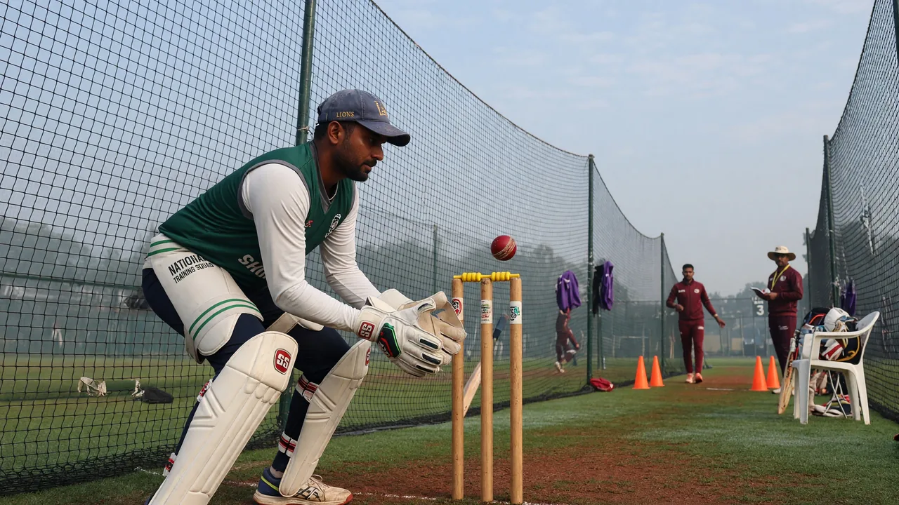 An all-rounder portrait at training with bat and ball on the side